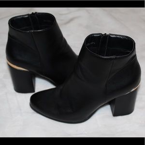 Black and gold boots